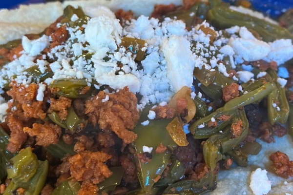 Nopales with pork and red sauce
